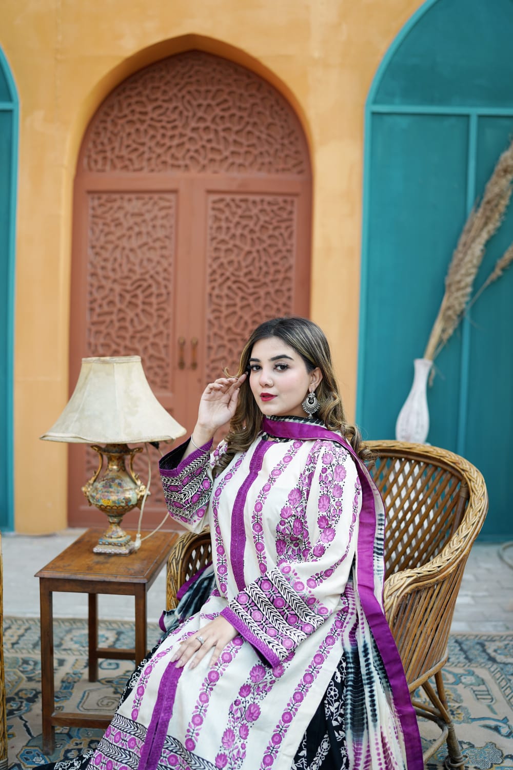 Premium Pakistani lawn suit by Zariyat. Features an off-white long kurti with purple embroidered panels and a bold black & white printed flared lehenga. A perfect blend of traditional heritage and modern festive elegance.
