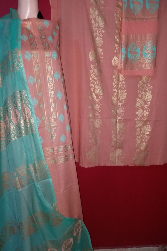 A 3-piece unstitched hand block print suit featuring a soft peach fine lawn shirt with turquoise and beige floral block-printed panels, paired with a vibrant turquoise chiffon dupatta