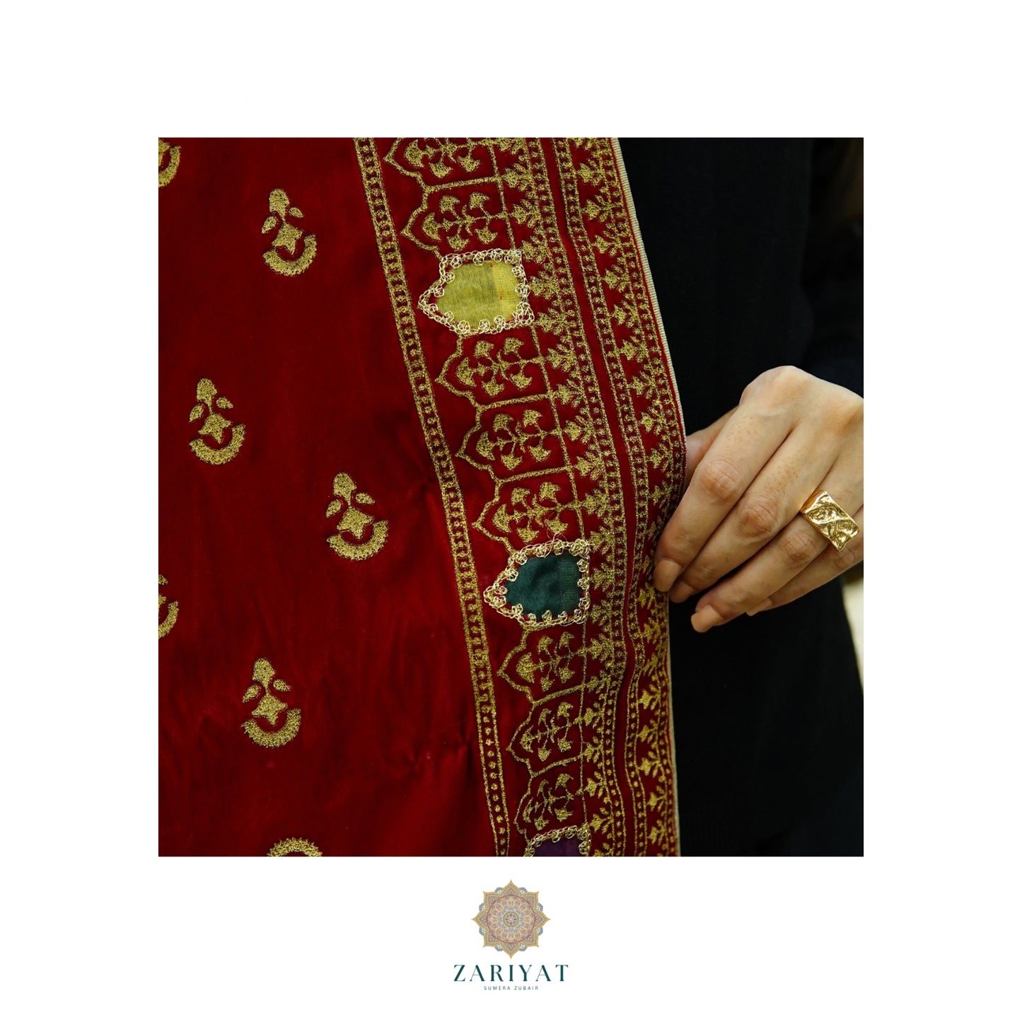 Red fabric with gold embroidery and a hand holding it, featuring the brand 'Zariyat'.