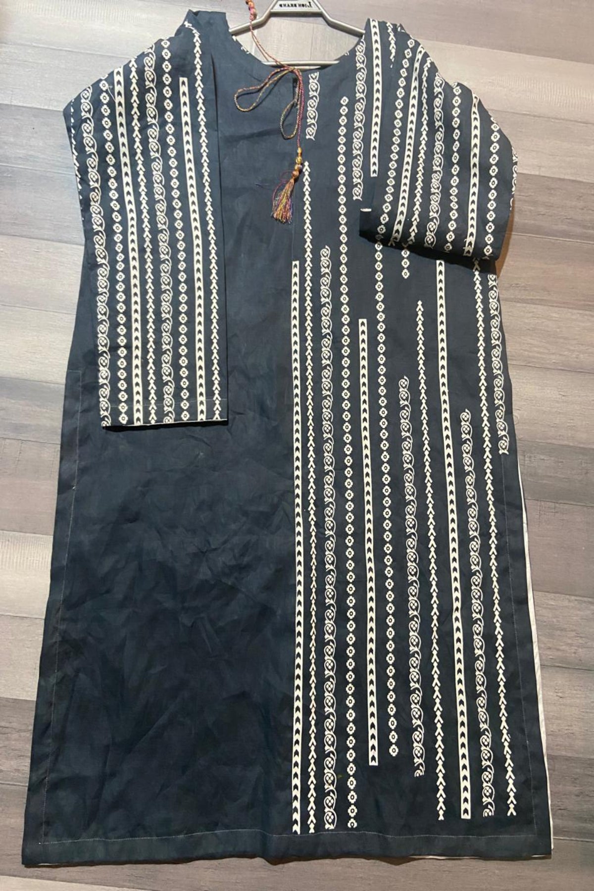 Black striped stitched long shirt in fine lawn featuring vertical white block print patterns and tassel neck detailing by Zariyat by Sumera.