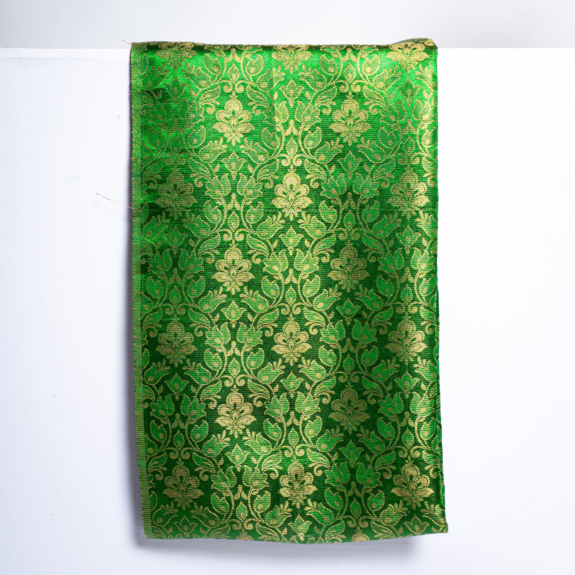 Rich emerald green fine raw silk unstitched trouser fabric with self-print pattern, matching the 3-piece mustard block print silk suit.
