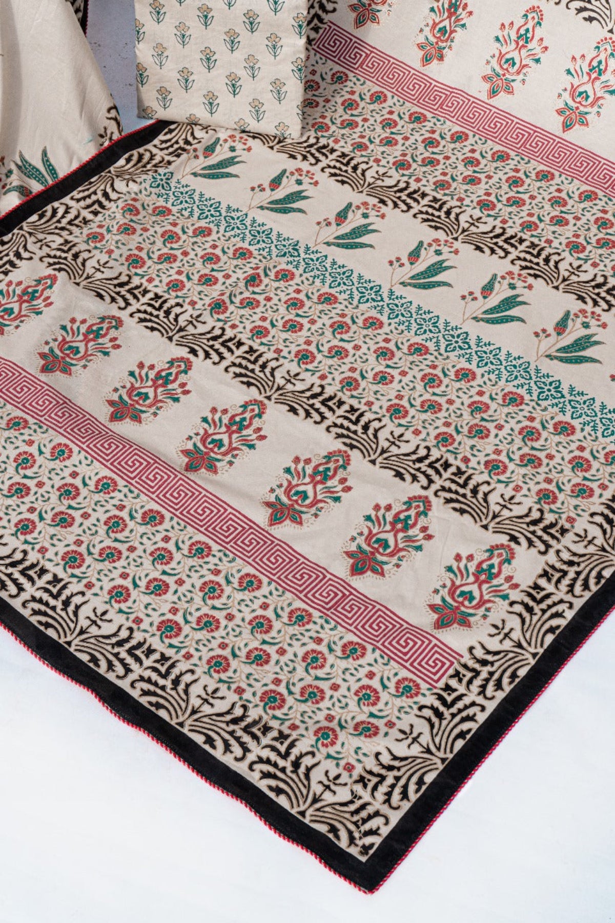 Detailed close-up of intricate traditional block print patterns on premium lawn fabric for an unstitched saree