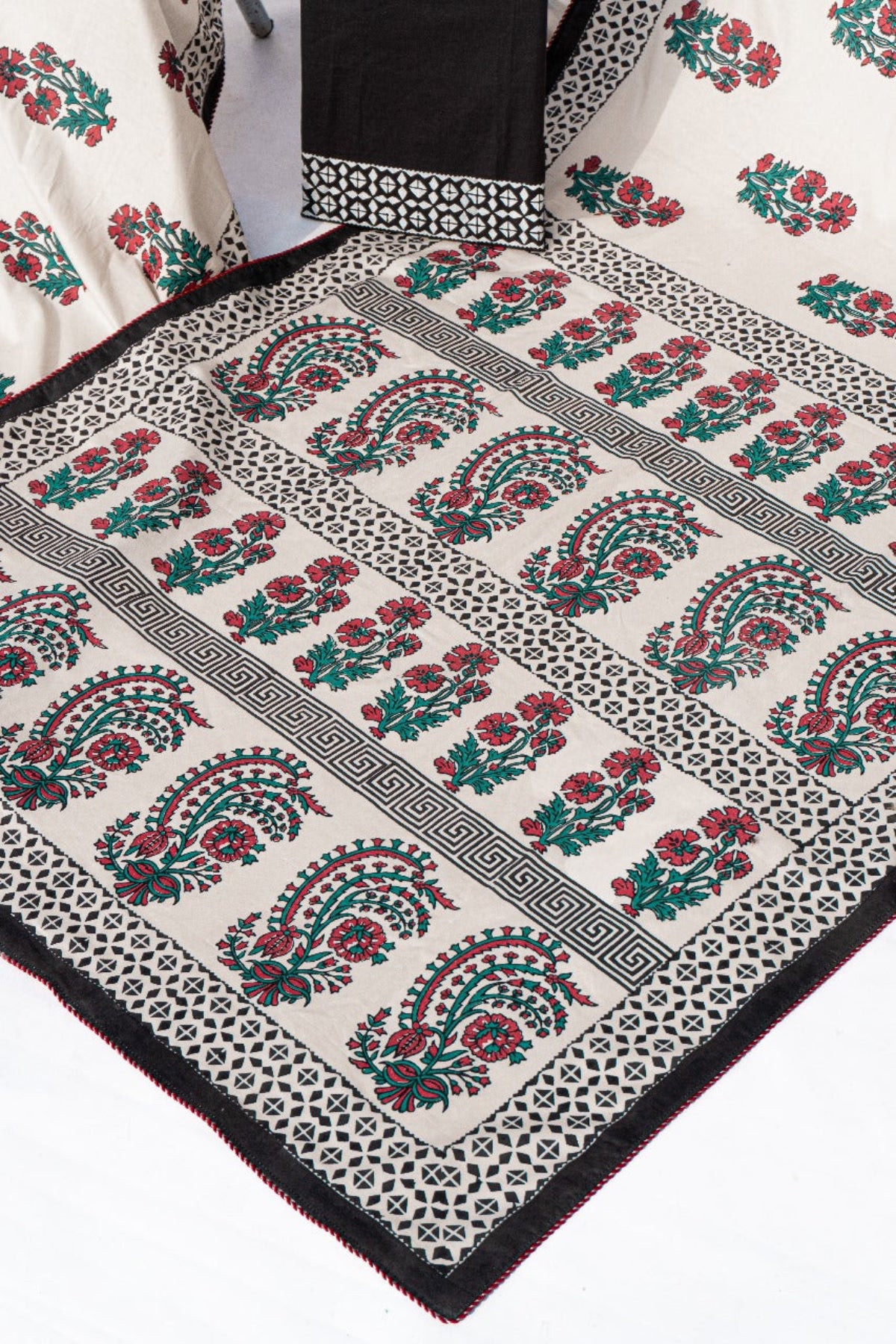 Folded black and off-white floral block print lawn saree with matching unstitched blouse piece by Zariyat by Sumera