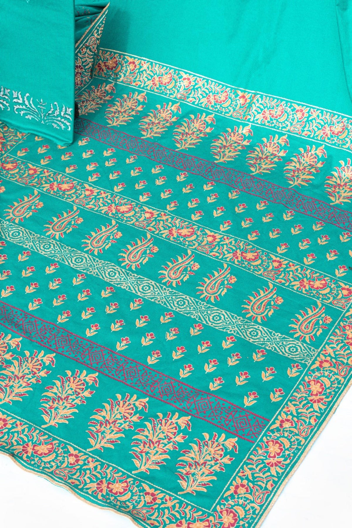 Close-up of teal green fabric featuring intricate floral and paisley hand block prints, Zariyat by Sumera collection