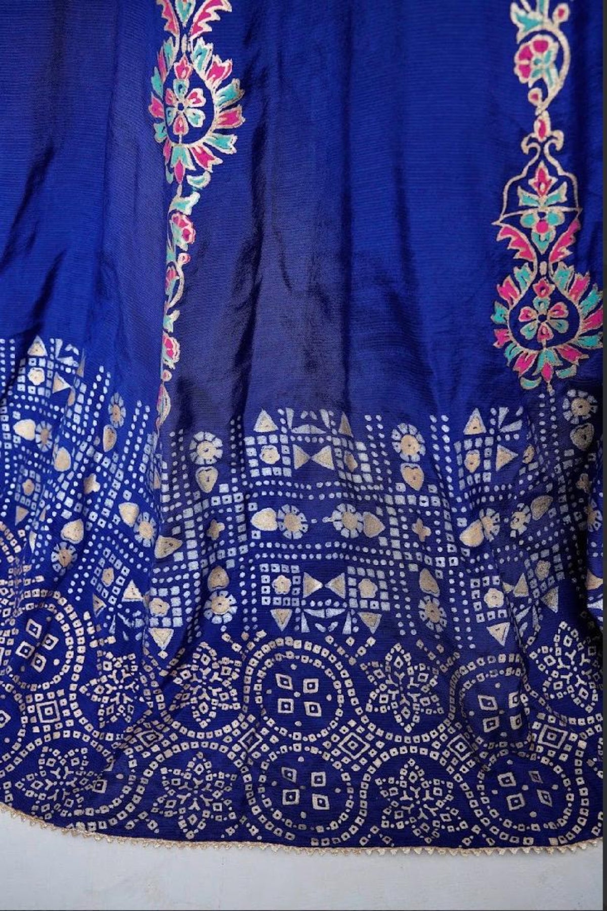Detailed view of the heavy block-printed flare and panels of the royal blue raw silk kalidar frock.