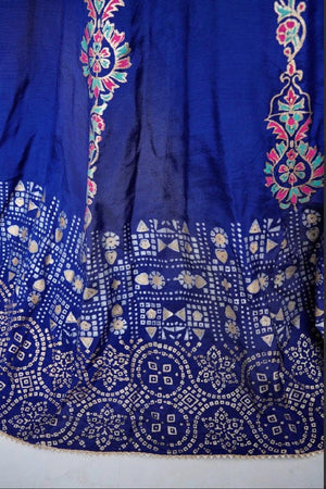 Detailed view of the heavy block-printed flare and panels of the royal blue raw silk kalidar frock.