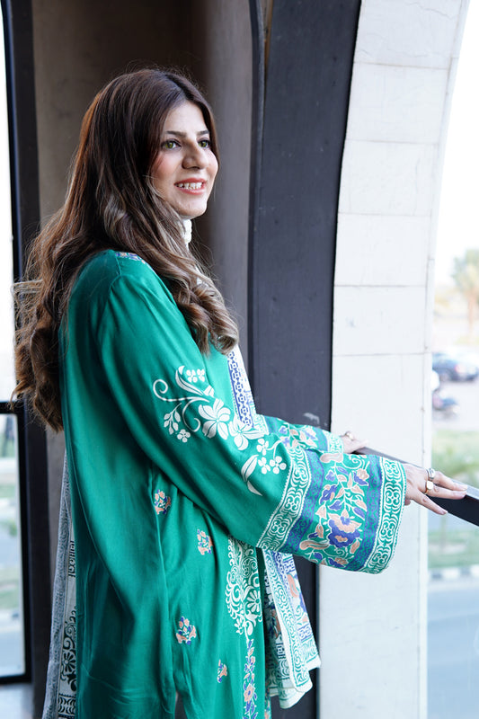 Model wearing emerald green luxury block printed lawn shirt by designer brand Zariyat by Sumera.