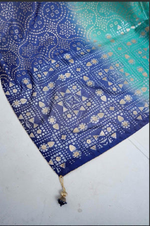 Detailed view of the heavy block-printed flare and panels of the royal blue raw silk kalidar frock.