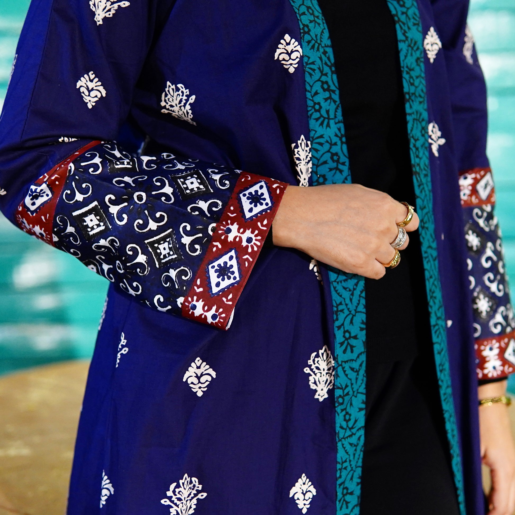 Close up of Zariyat by Sumera silk gown showing intricate ajrak border print on sleeves