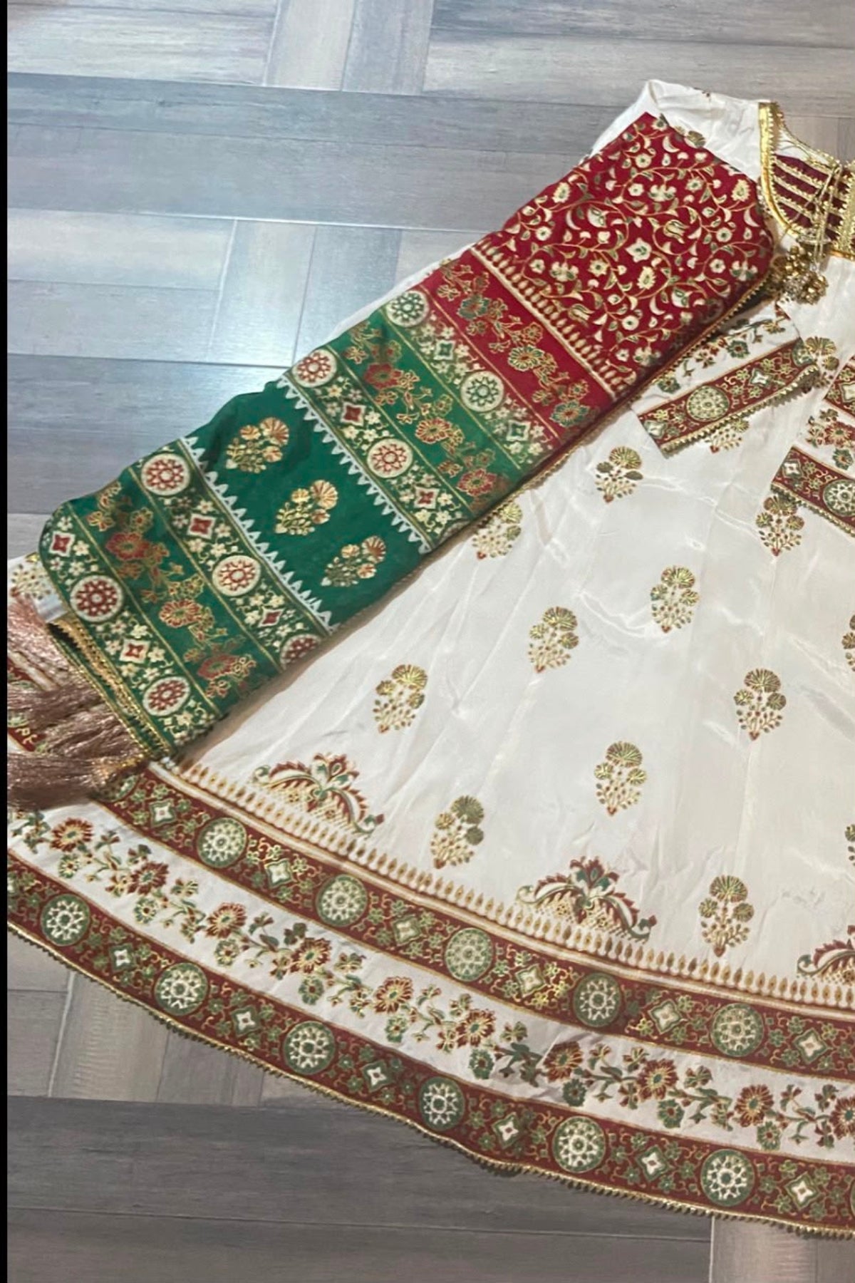 Close-up display showcasing the exquisite block-printed patterns on the white raw silk kalidar frock alongside the folded multi-toned silk dupatta.