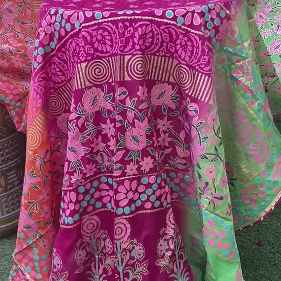 Draped view of multi-color shaded silk dupatta showcasing intricate floral patterns and a four-sided golden massuri trim.
