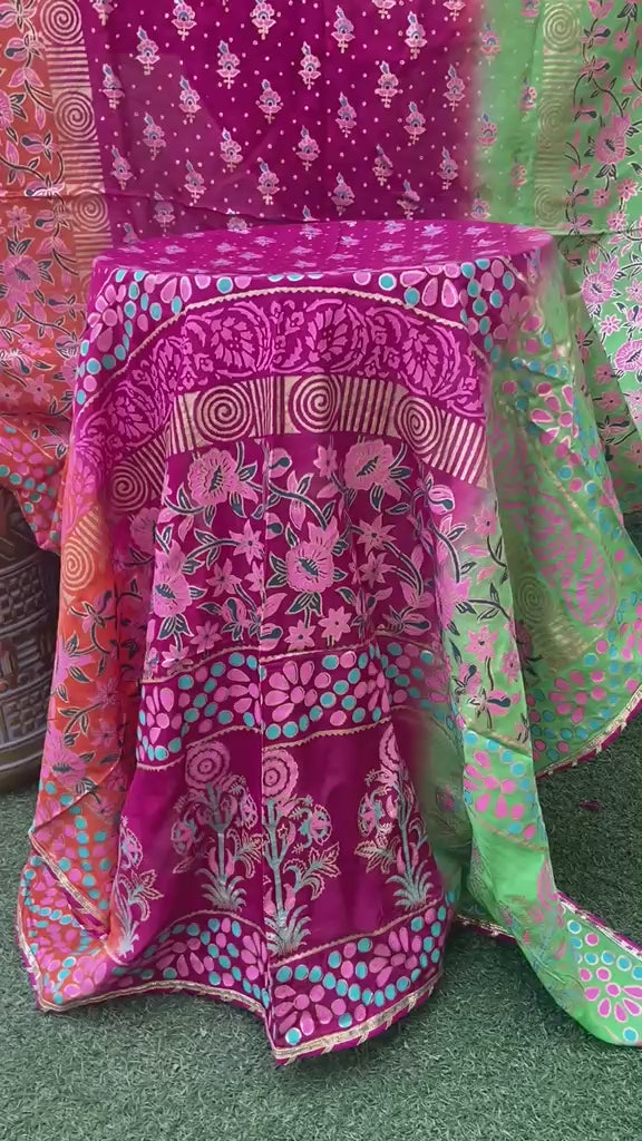 Draped view of multi-color shaded silk dupatta showcasing intricate floral patterns and a four-sided golden massuri trim.
