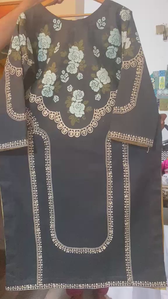 Flat lay view of black lawn kurti showcasing traditional hand block-printed floral patterns