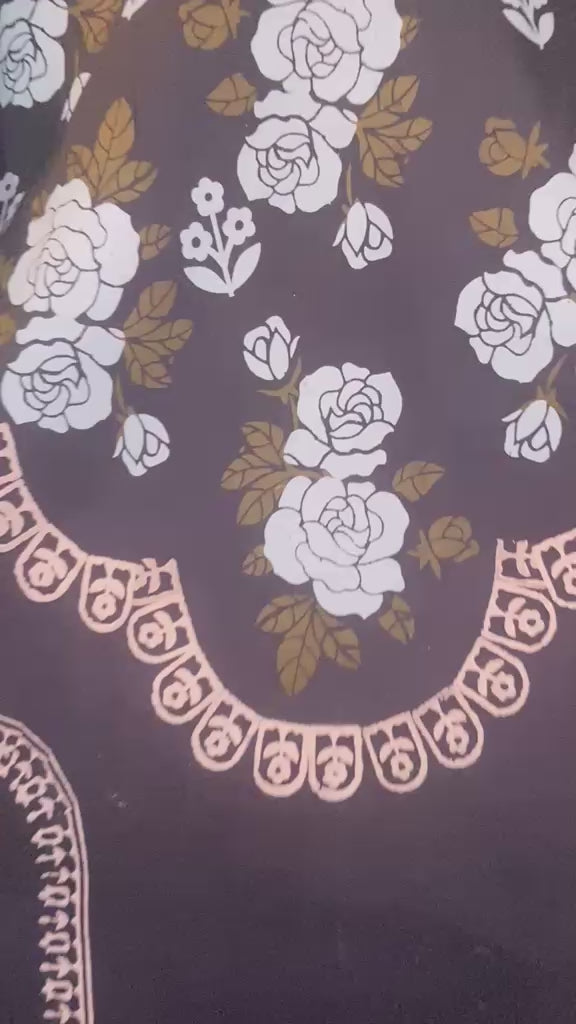 Flat lay view of black lawn kurti showcasing traditional hand block-printed floral patterns