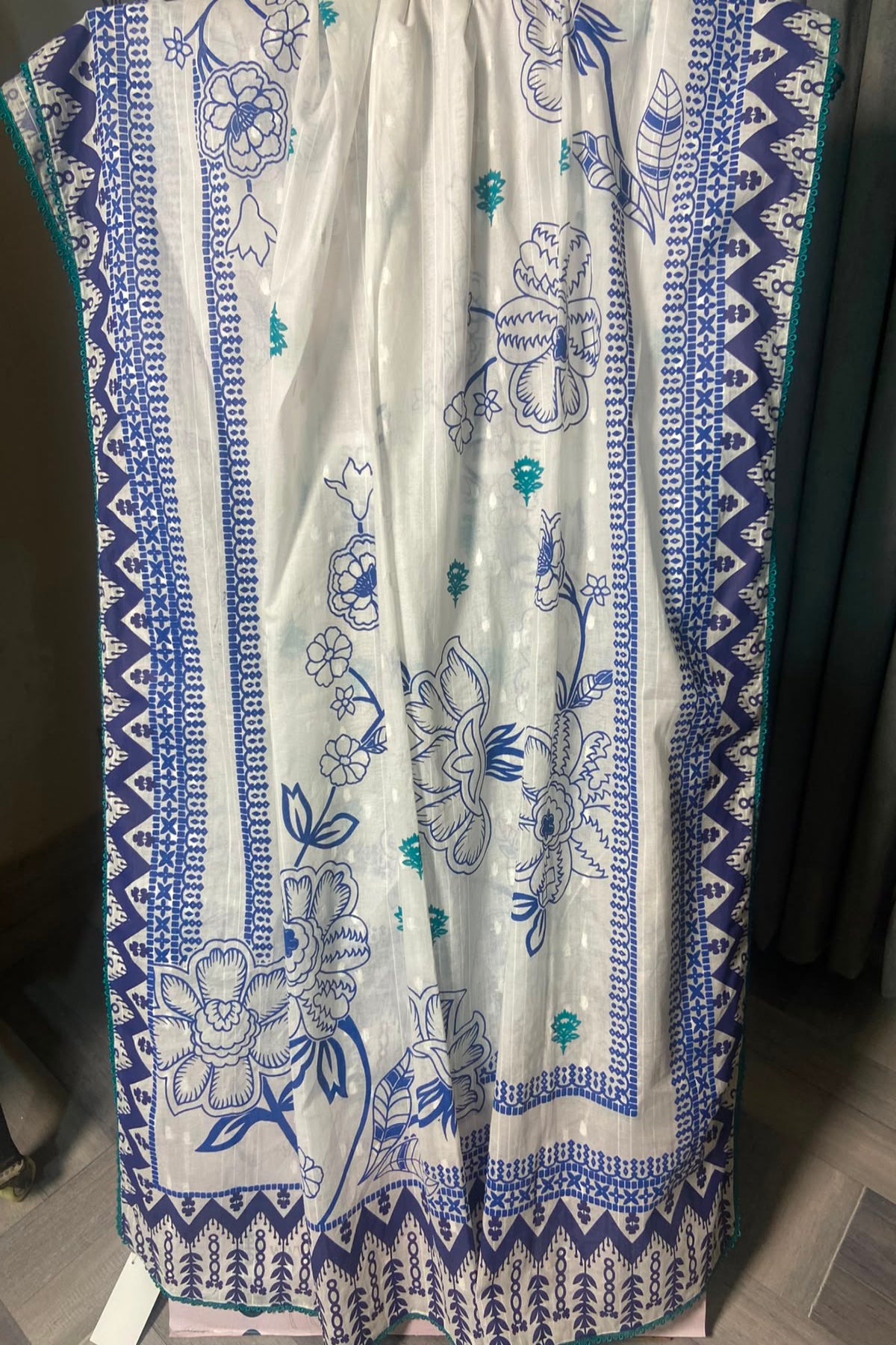 White and blue dooria lawn block print dupatta featuring floral motifs, teal accents, and lace edging