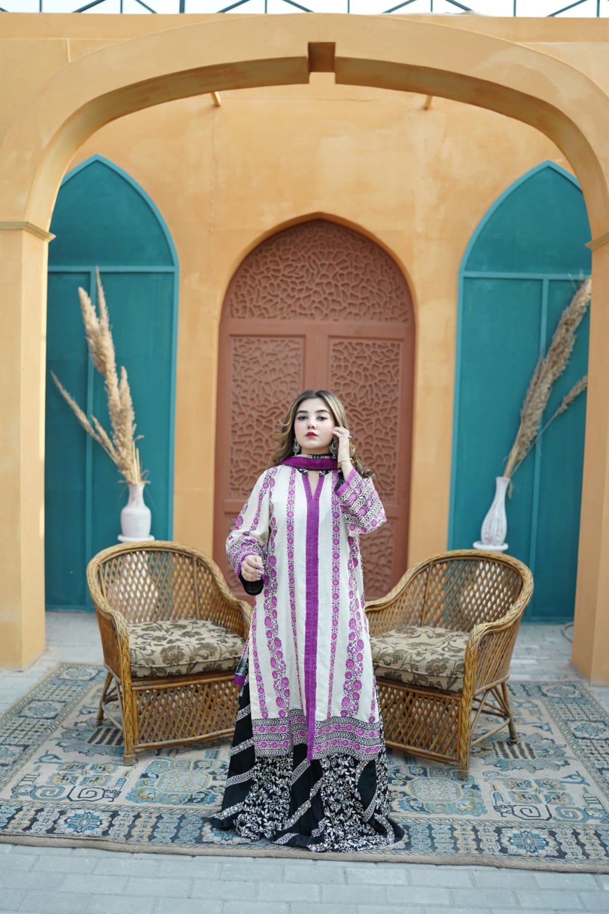 A woman showcasing a stylish hand-block print outfit.