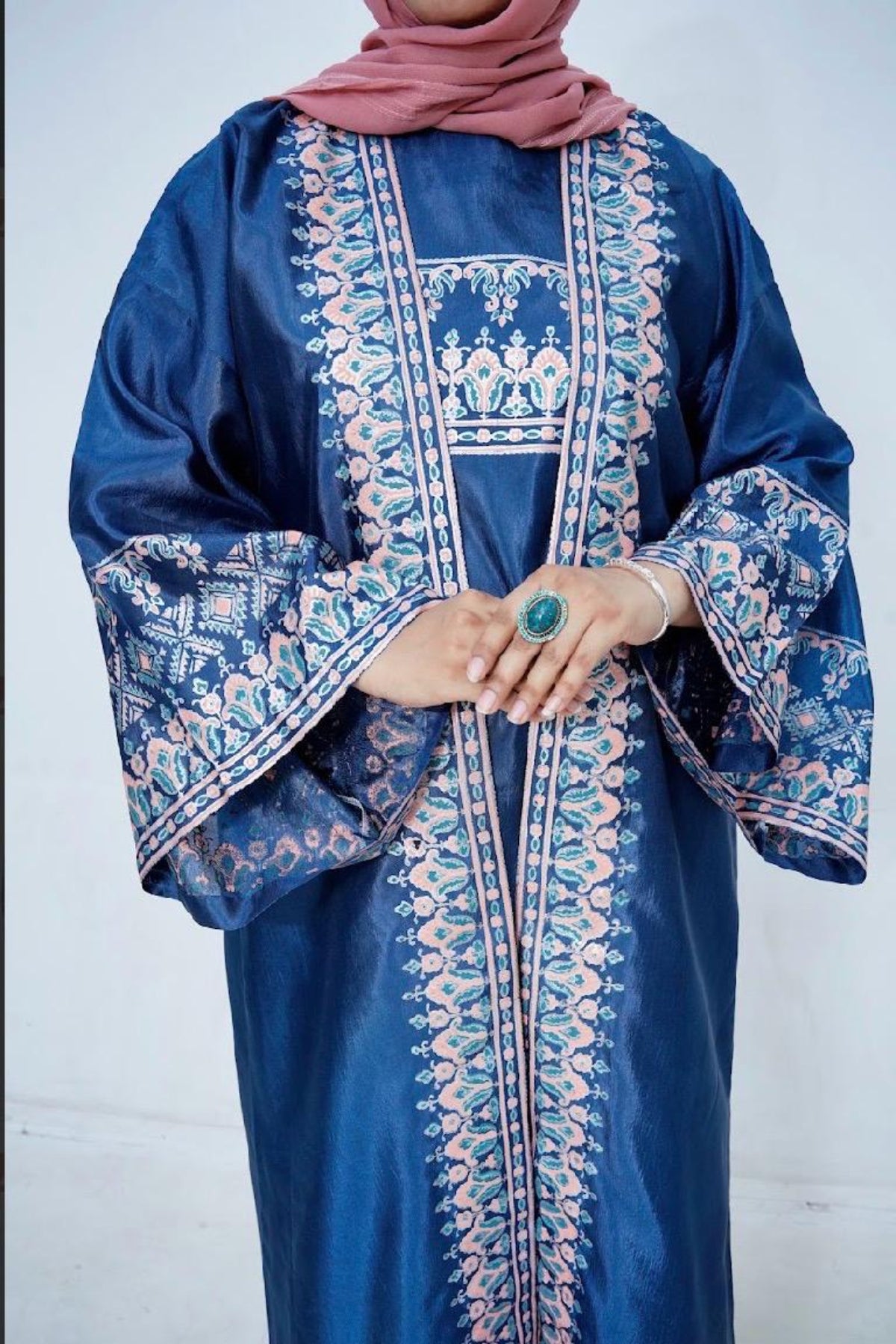 Close-up front view of handcrafted block print detailing on a premium Katan Silk long dress with broad sleeves by Zariyat by Sumera.