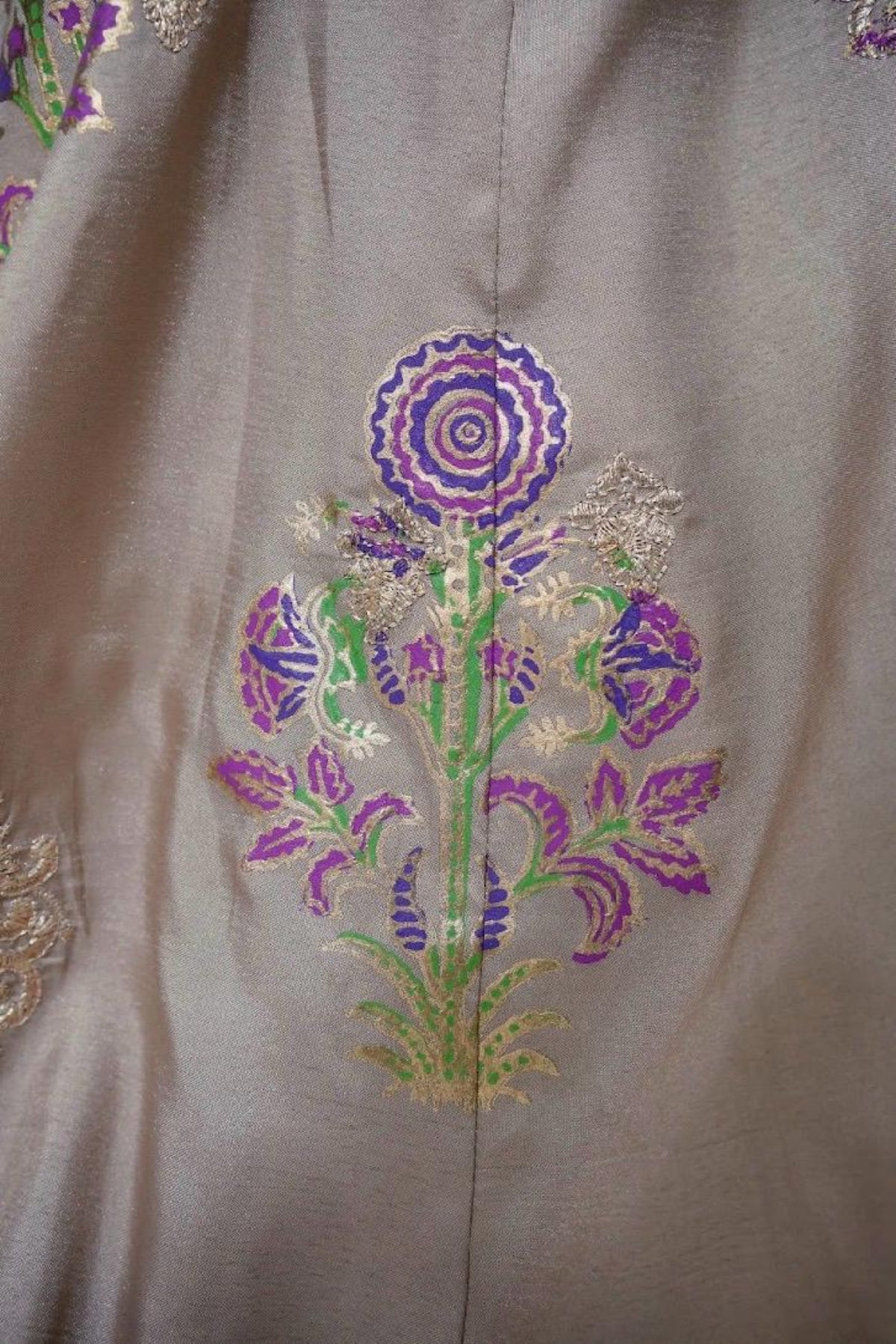 Close-up of handcrafted floral block print with Zari work on premium raw silk fabric by Zariyat by Sumera