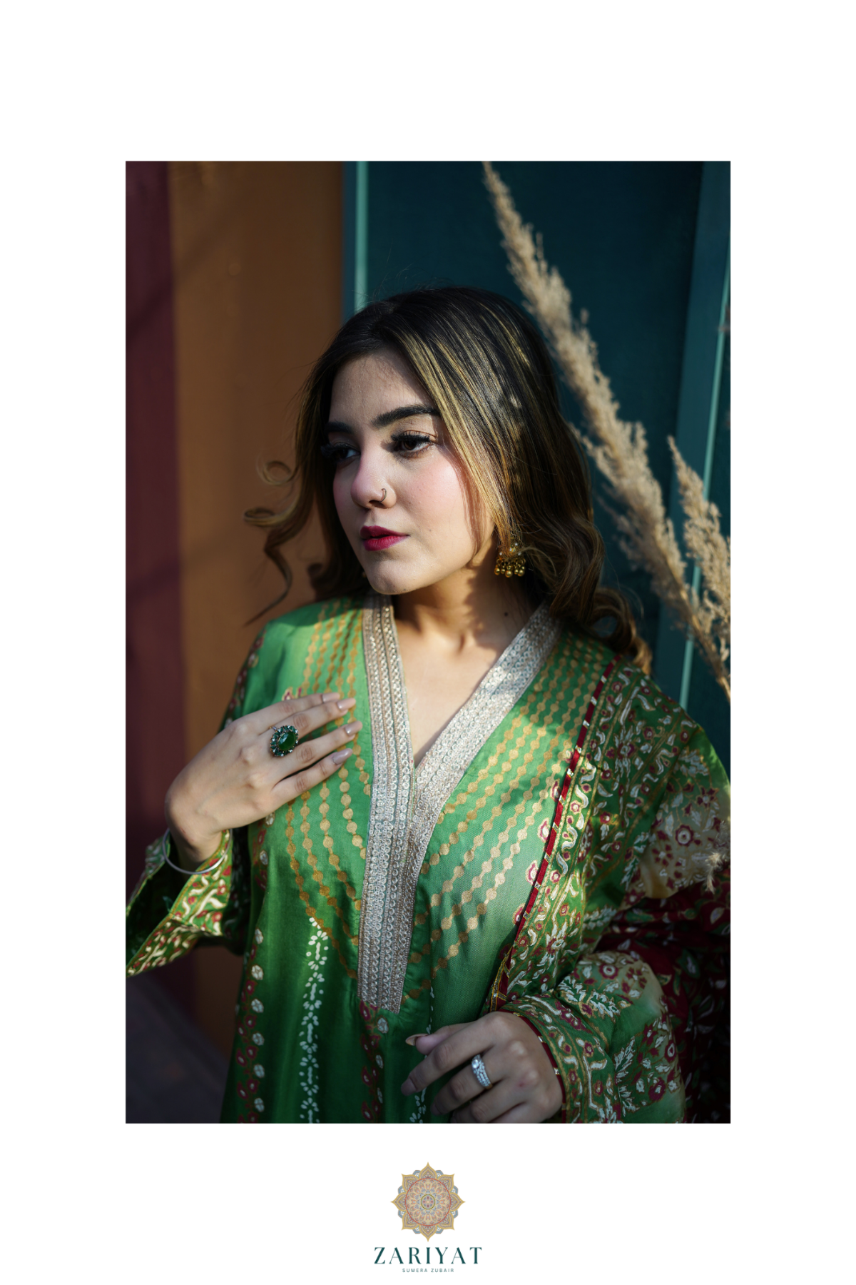 Detailed neckline design of Zariyat by Sumera green fine raw silk shirt with premium block print and gold embellishments.