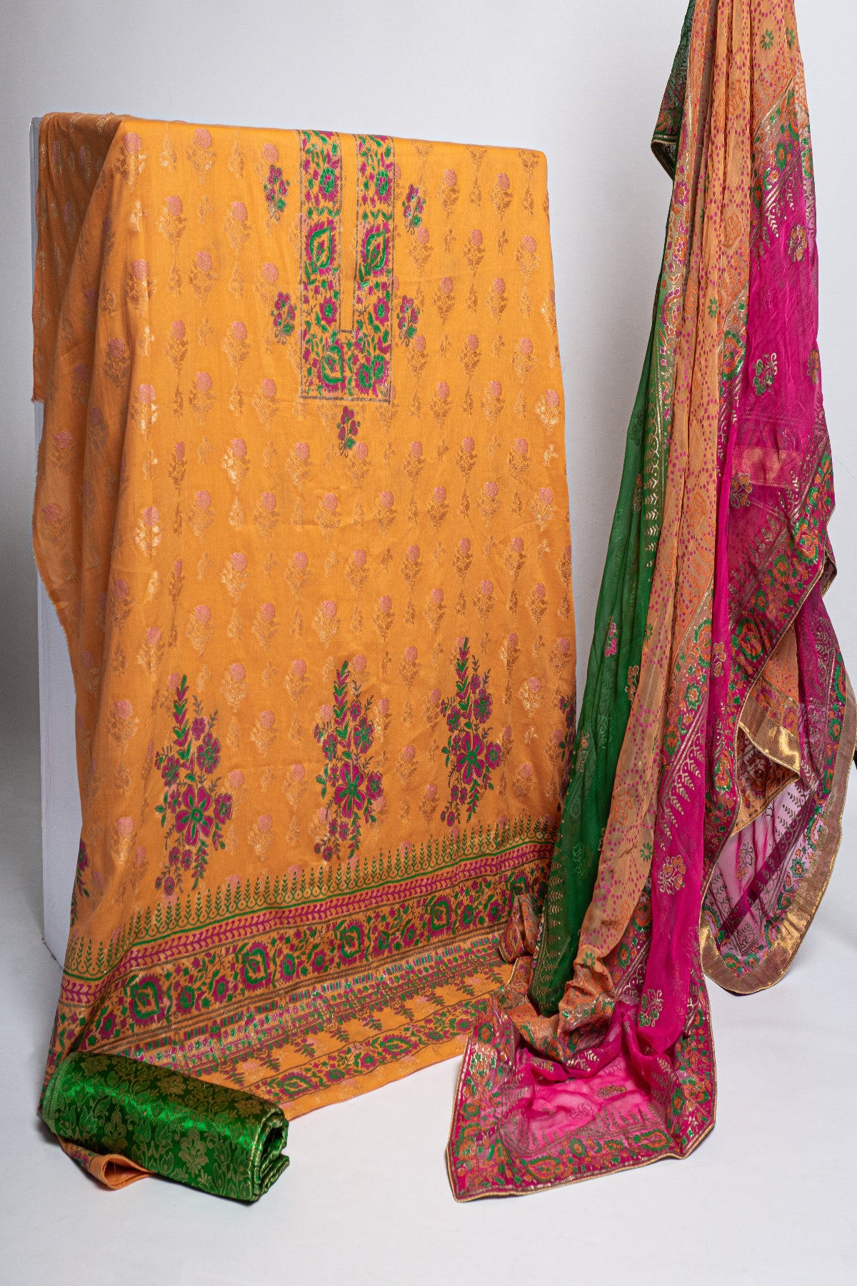 Zariyat by Sumera premium mustard yellow block print 3-piece unstitched fine raw silk suit with green trouser and multi-color medium silk dupatta.
